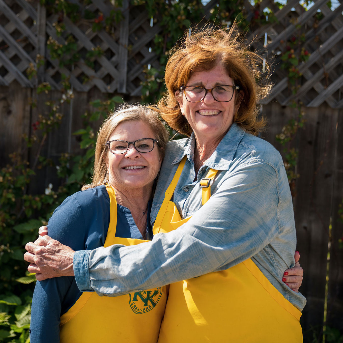 Kathleen & Kay posing together outside their garden